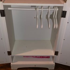 White doll clothes closet (includes hangers and a doll sleeping bag)